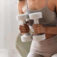 woman holding dumbbells